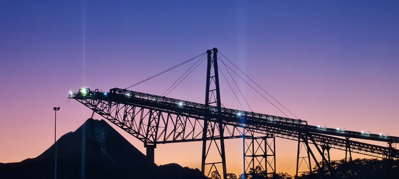 Stacker conveyor at a coal operation at dusk
